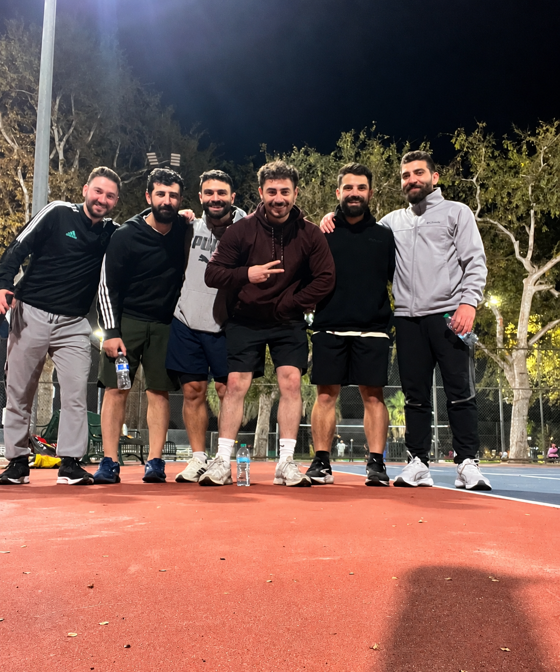 Community playing tennis together
